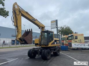 Caterpillar M315 excavadora de ruedas